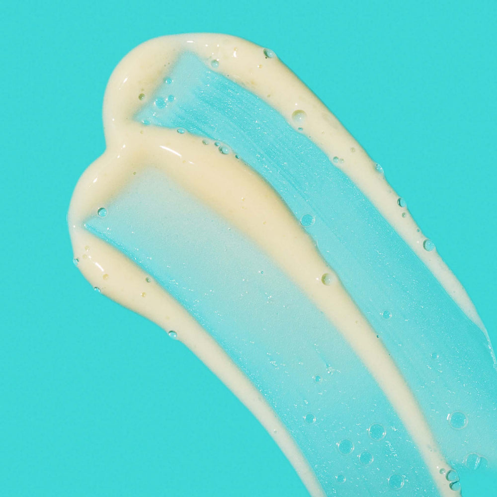 Close-up of a blue and beige color swatch on a turquoise background