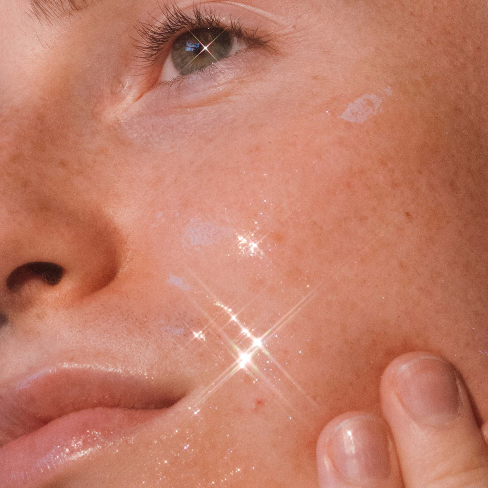 Close-up of a person's face with a bright light source