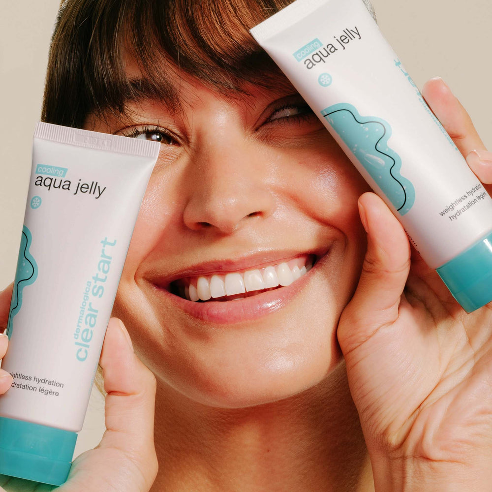 Person holding two 'aqua jelly' skincare products near their face