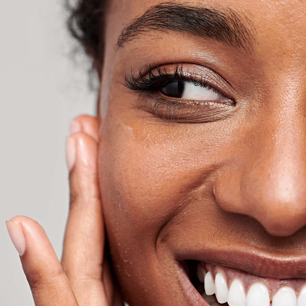 Close-up of a woman's face with a neutral background
