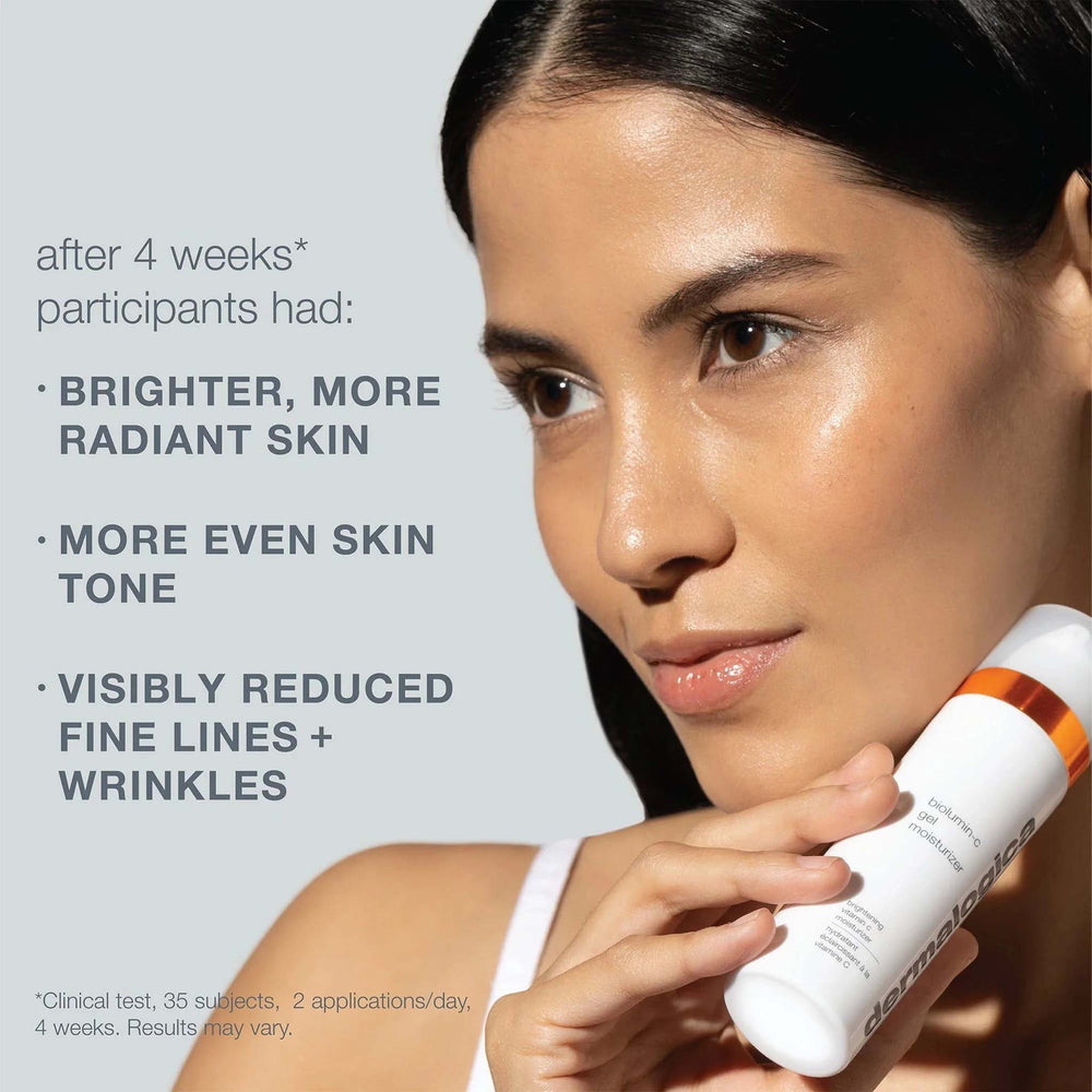 Woman holding a dermalogica biolumin-c gel moisturiser with text about skin benefits on a light gray background