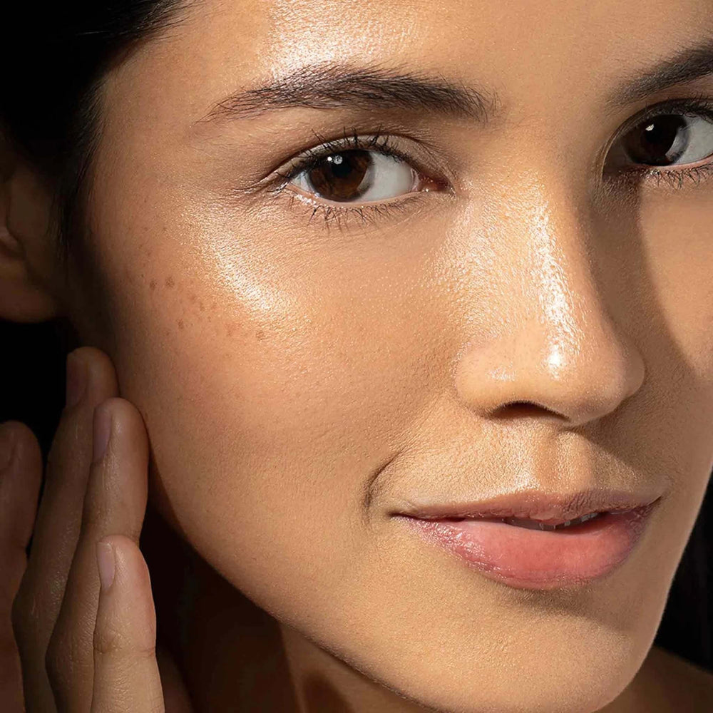 Close-up of a woman's face with a soft focus on her skin texture.