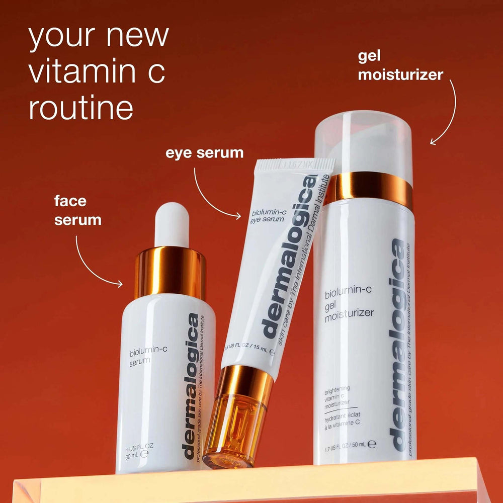 Dermalogica biolumin-c products including face serum, eye serum, and gel moisturizer on a red background.
