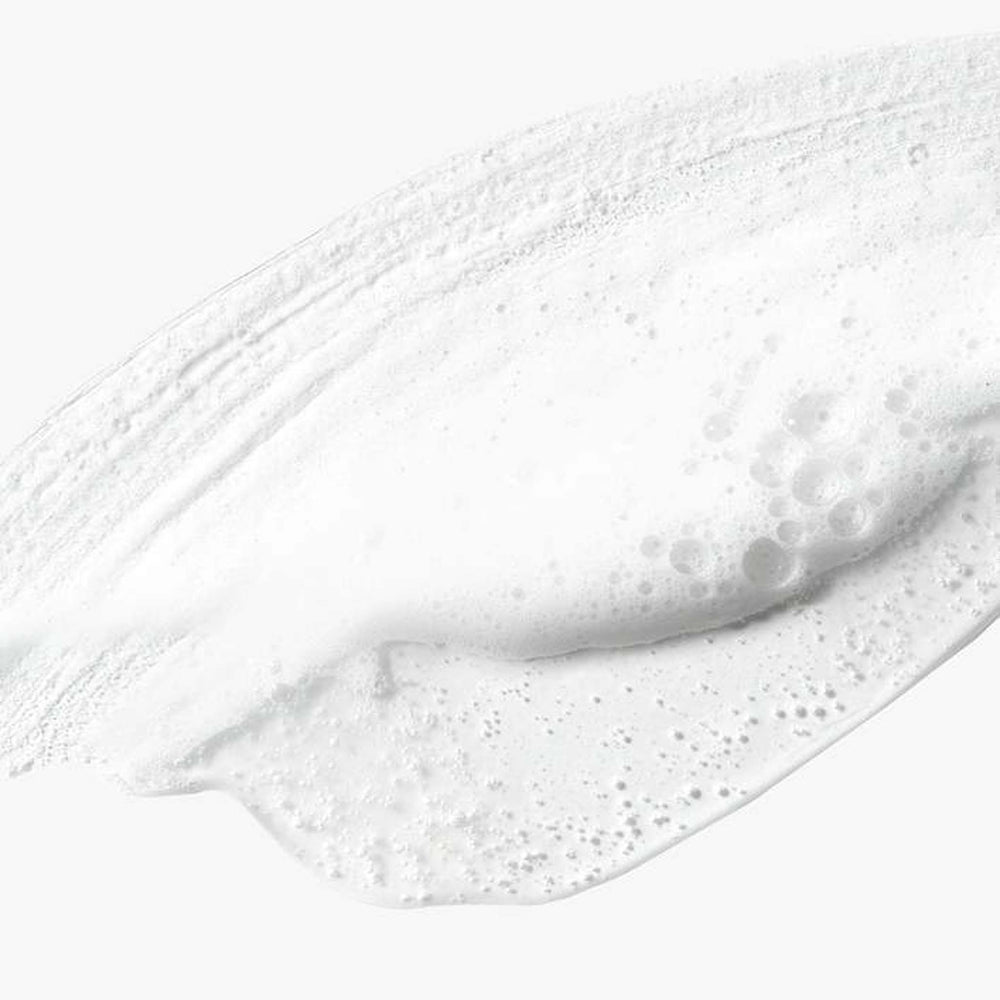 Close-up of dermalogica daily glycolic cleanser with bubbles on a white background